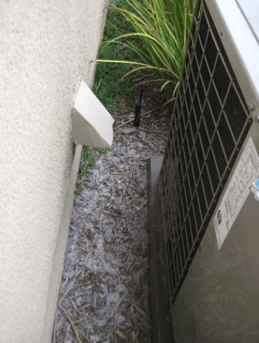 Part 2 of 2 figures- showing a noncompliant condensing unit clearance from a dryer vent at a different angle Part 2 of 2 figures- showing a noncompliant condensing unit clearance from a dryer vent at a different angle
